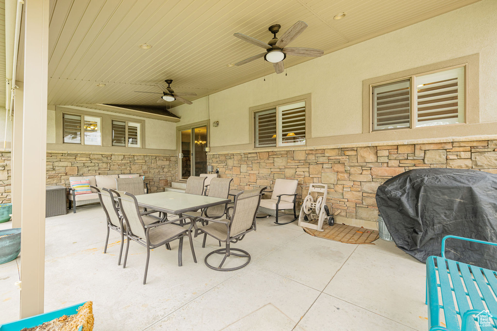View of patio / terrace with a ceiling fan, a grill, and outdoor dining area