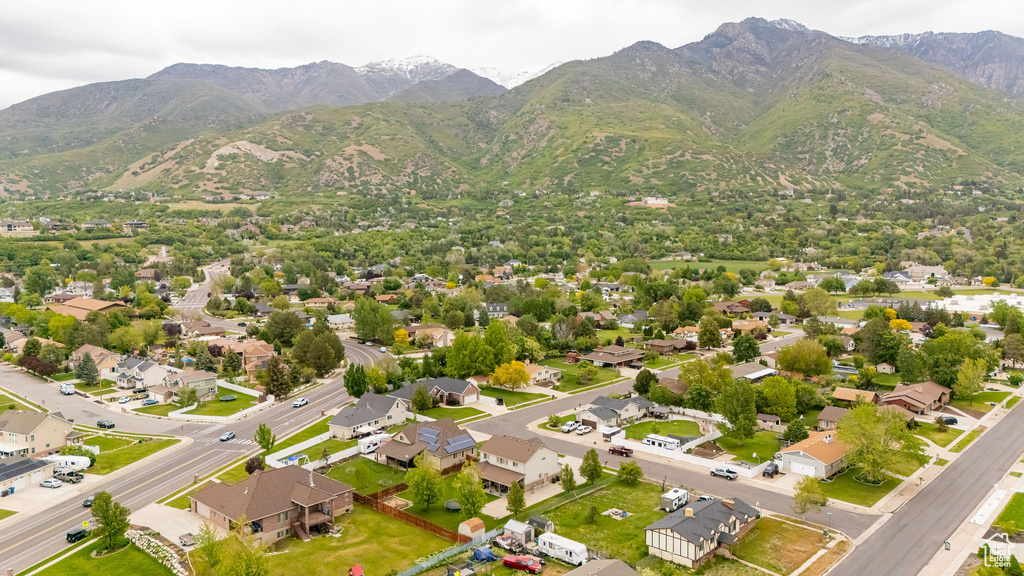 Aerial view of residential area featuring a mountainous background
