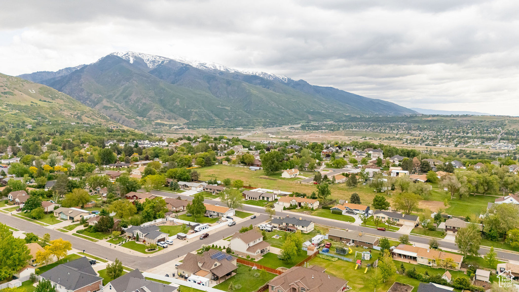 Aerial perspective of suburban area with a mountainous background