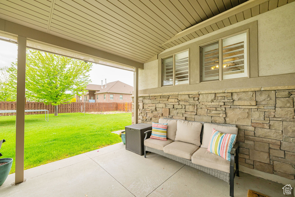 View of patio with an outdoor living space