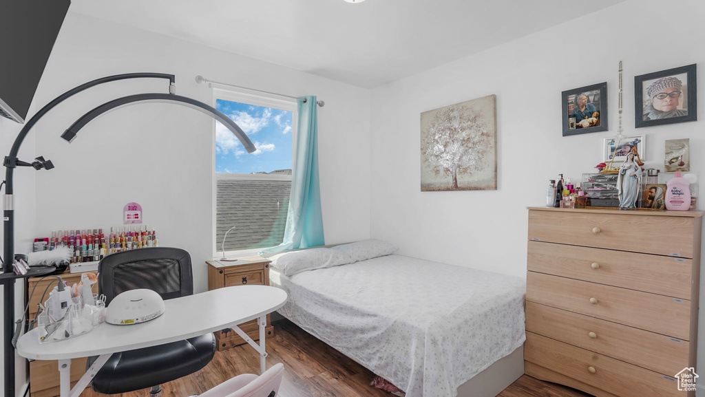 Bedroom with wood finished floors