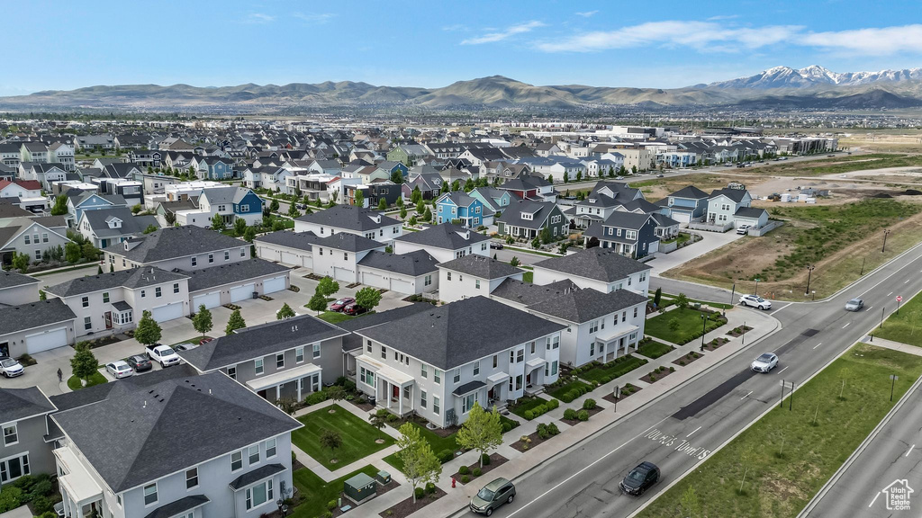 Aerial perspective of suburban area featuring a mountain backdrop