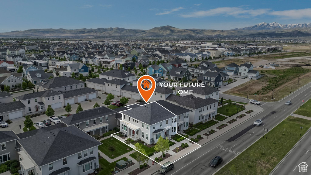 Aerial view of residential area with a mountain backdrop