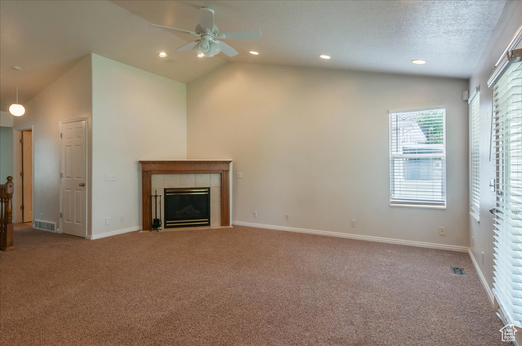 Unfurnished living room with a tile fireplace, carpet, ceiling fan, baseboards, and recessed lighting