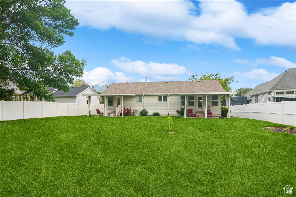 Rear view of house with a patio