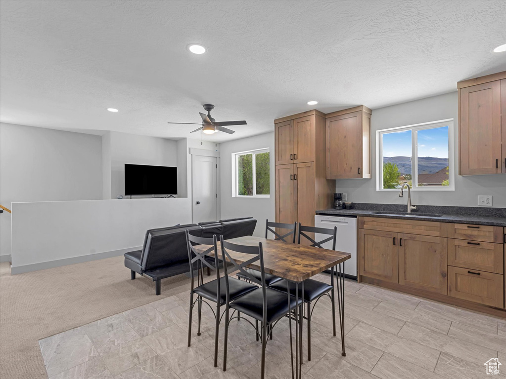 Dining space featuring ceiling fan and recessed lighting