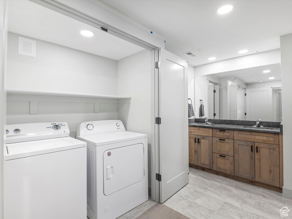 Clothes washing area with independent washer and dryer and recessed lighting
