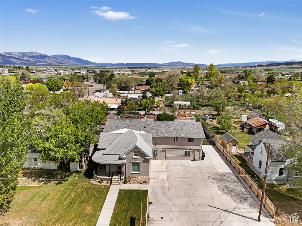 Aerial perspective of suburban area with a mountain backdrop