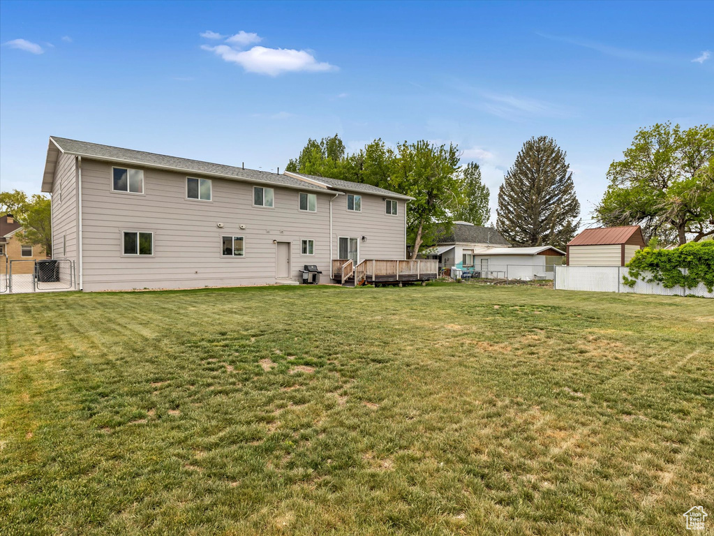 Back of property featuring a deck