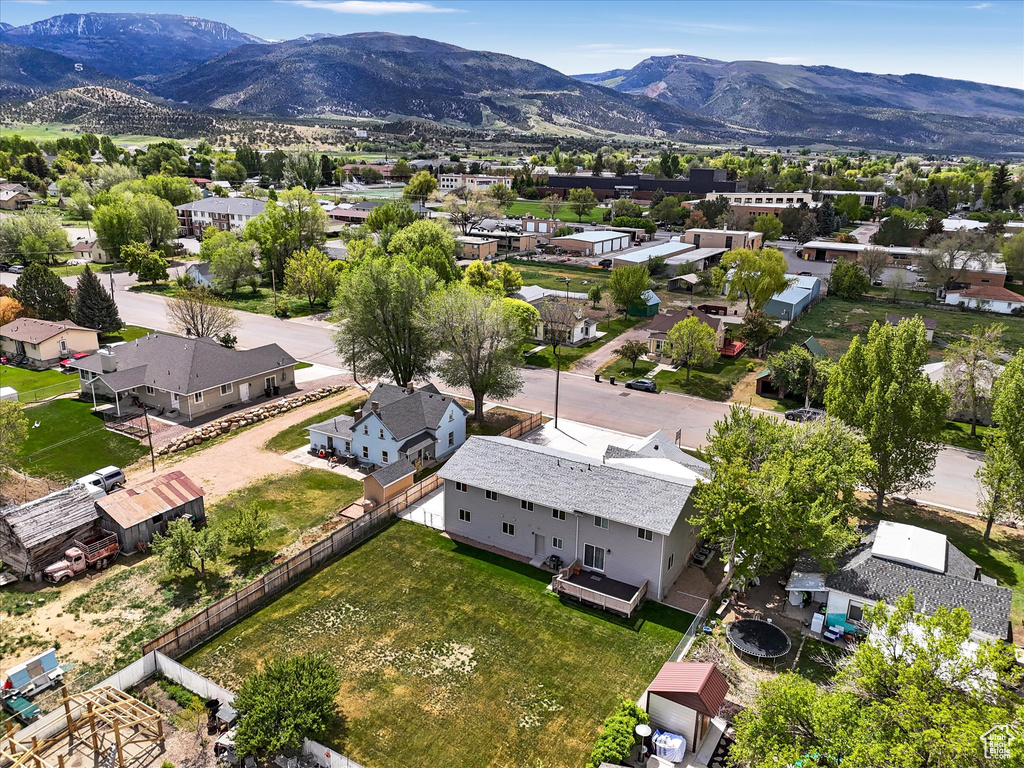 Aerial view of residential area featuring mountains