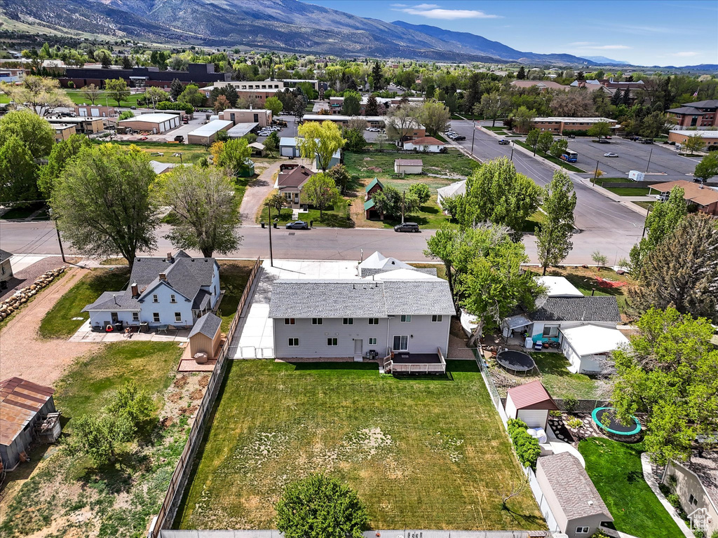 Aerial perspective of suburban area featuring a mountain backdrop