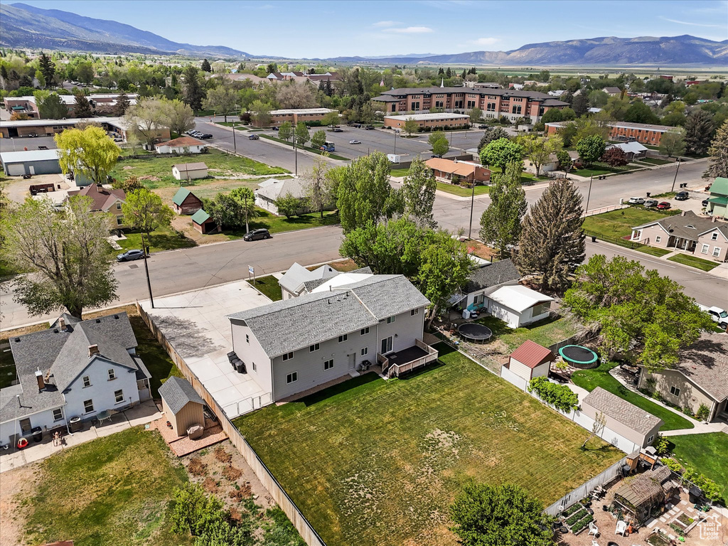 Aerial perspective of suburban area featuring a mountainous background