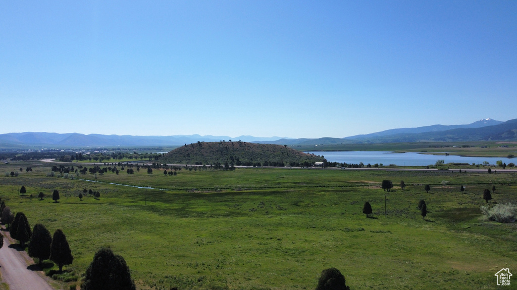 Mountain view with a large body of water and rural landscape