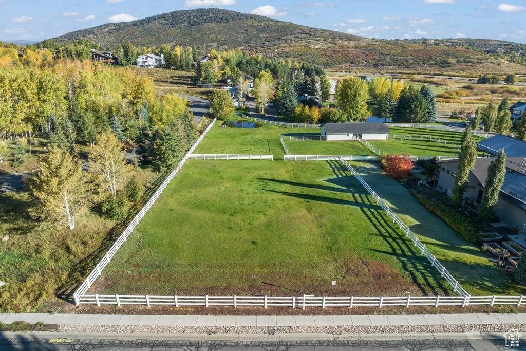 Overview of rural landscape featuring a mountain backdrop