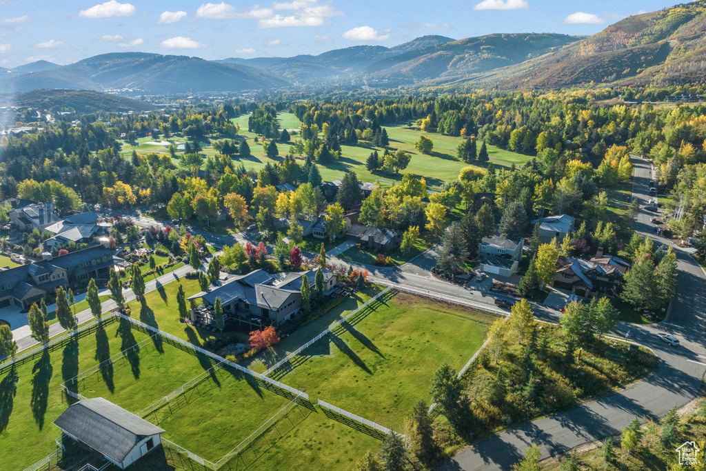 Aerial overview of property's location featuring a mountain backdrop