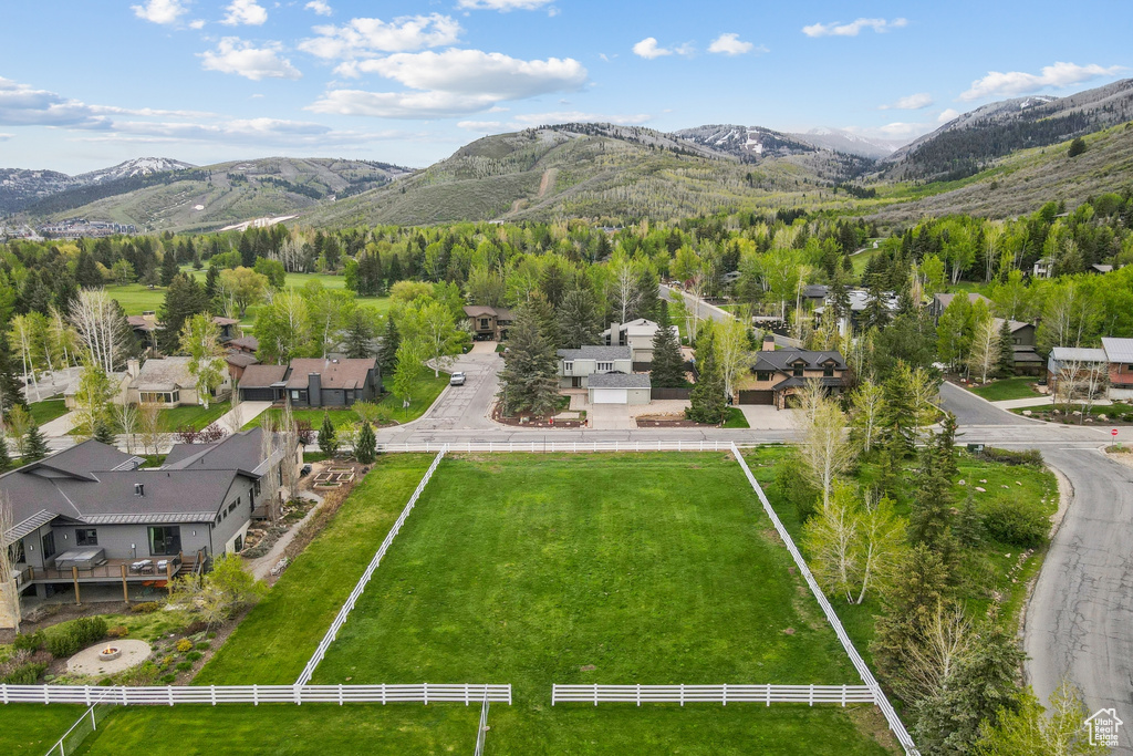 View of mountain backdrop featuring nearby suburban area
