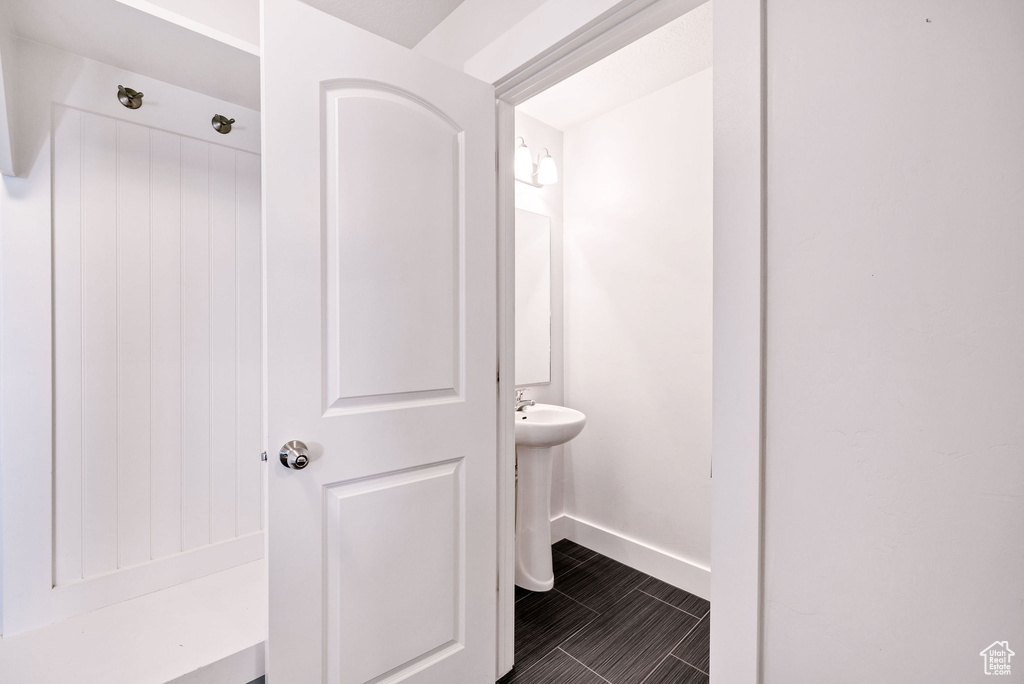 Bathroom featuring baseboards and tile patterned floors
