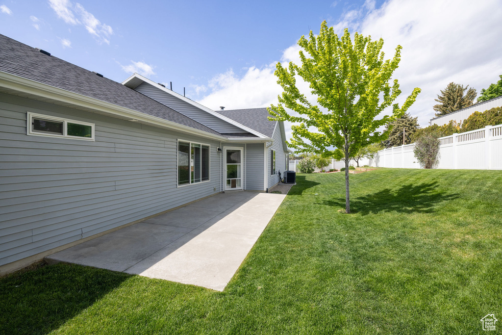 View of yard with a patio