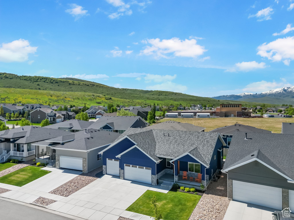 Aerial view of residential area featuring a mountainous background