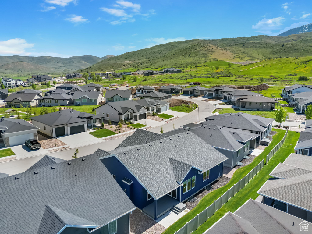 Aerial perspective of suburban area featuring a mountainous background