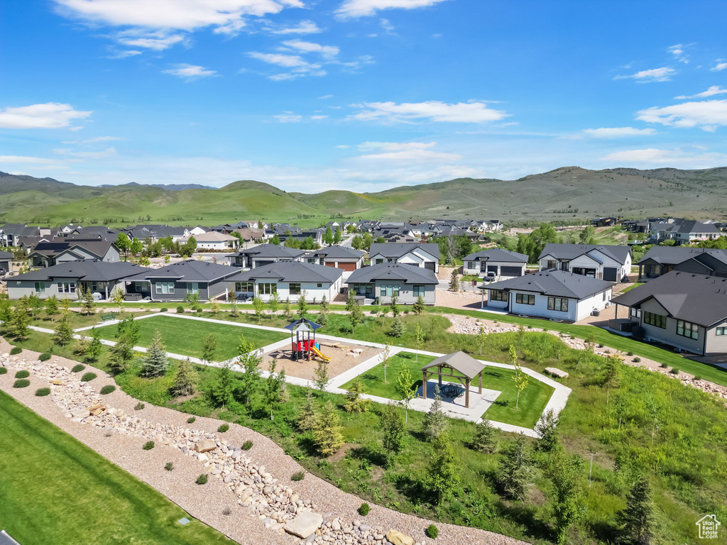 Aerial perspective of suburban area with a mountainous background