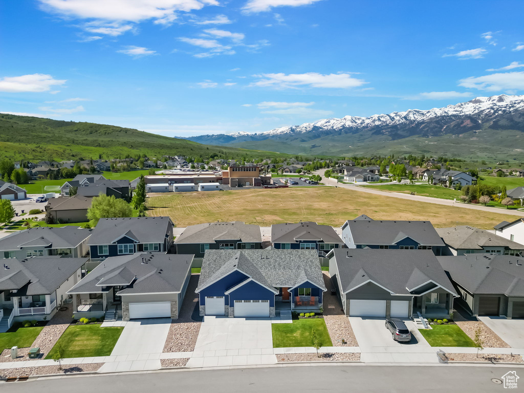 Aerial view of residential area with a mountainous background