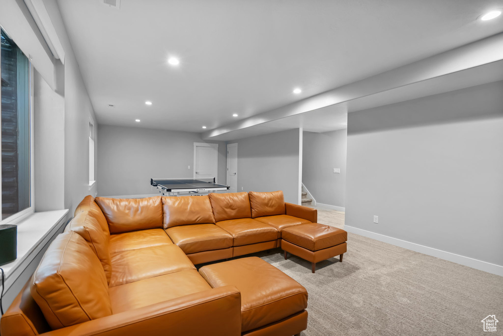 Living room featuring recessed lighting, stairs, carpet floors, and baseboards