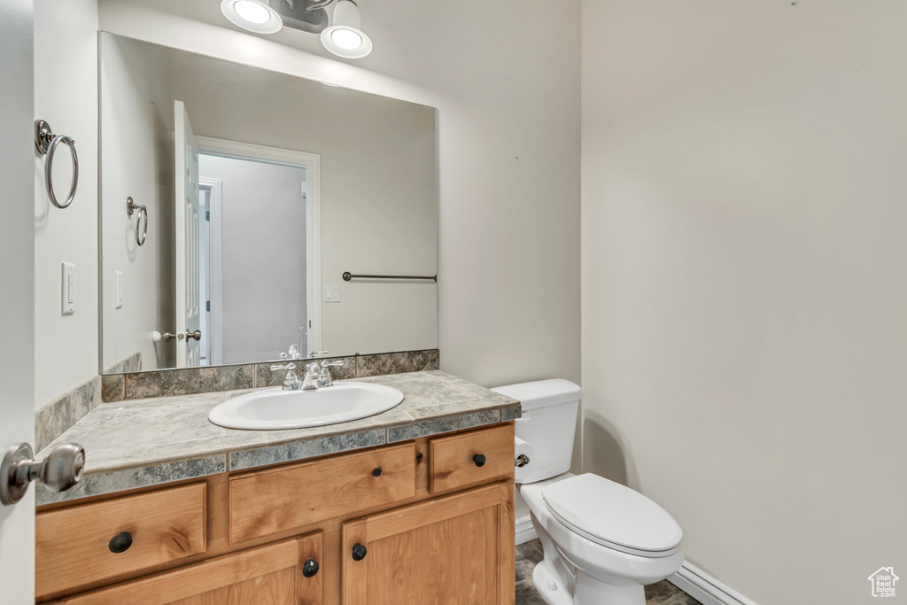 Bathroom featuring toilet and vanity