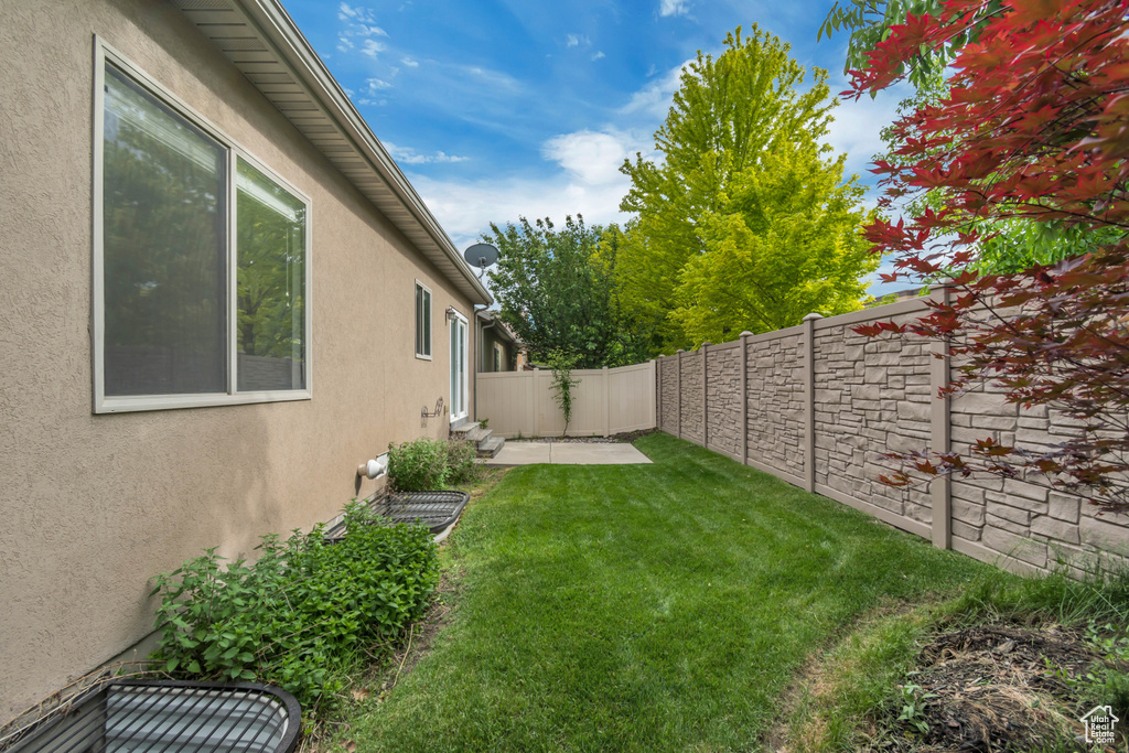 View of yard with a patio