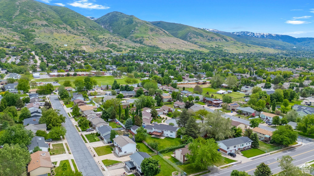 Aerial view of residential area featuring a mountain backdrop