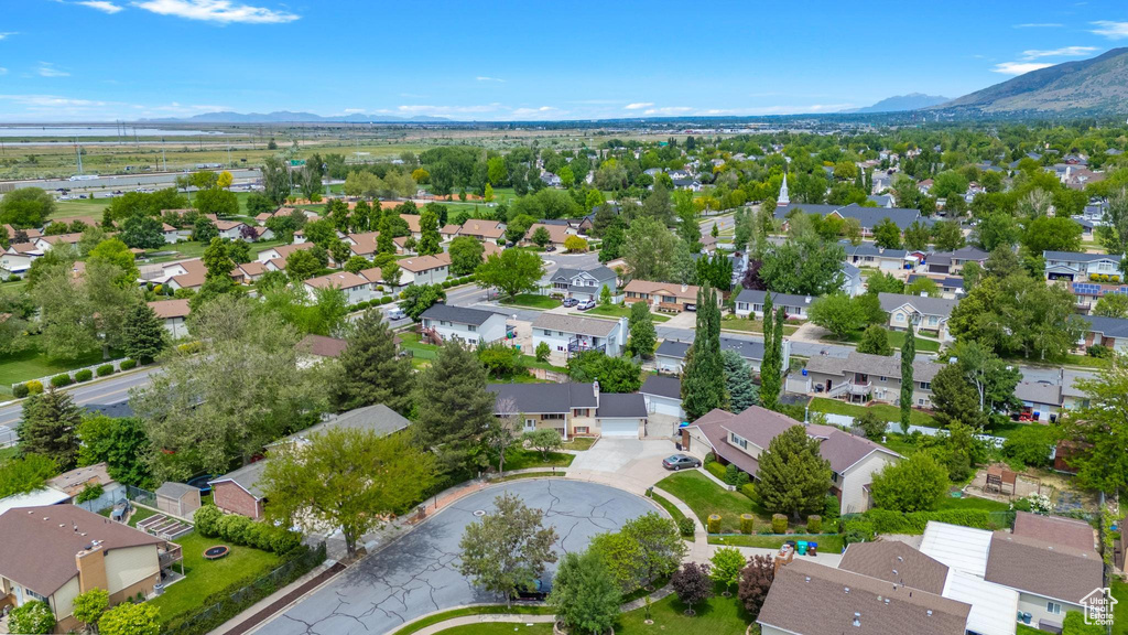 Aerial perspective of suburban area with a mountain backdrop