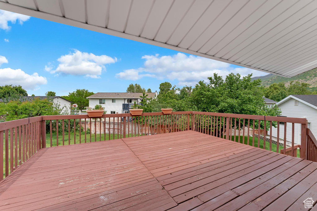 Wooden deck with a residential view