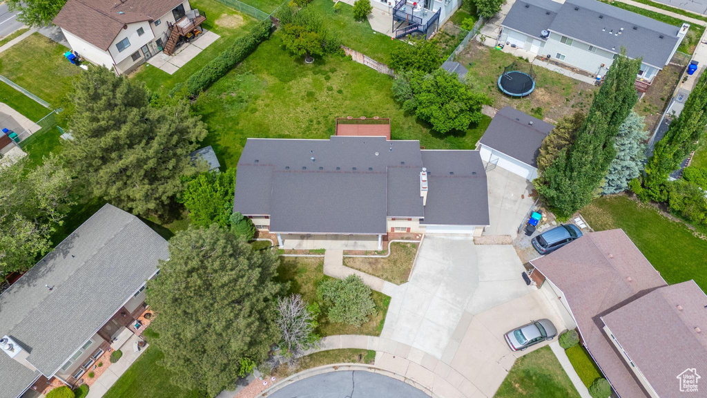 Aerial view of property and surrounding area with nearby suburban area