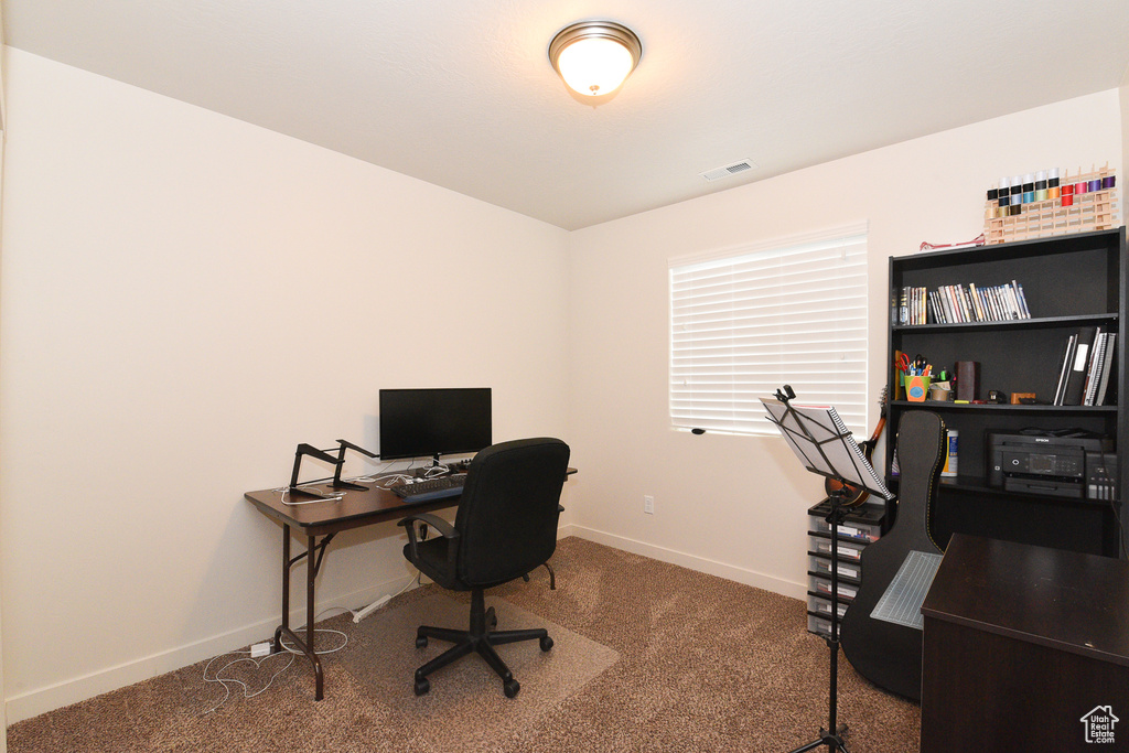 Office with carpet flooring and baseboards
