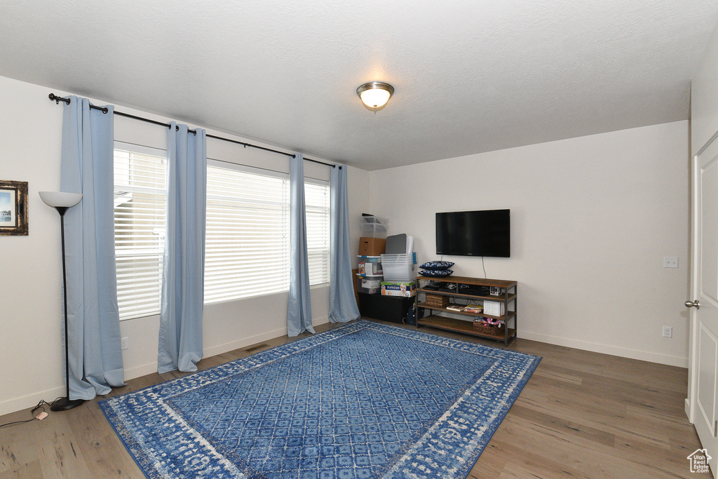 Living room with wood finished floors and baseboards