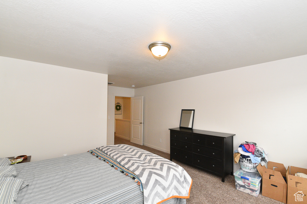 Bedroom featuring carpet