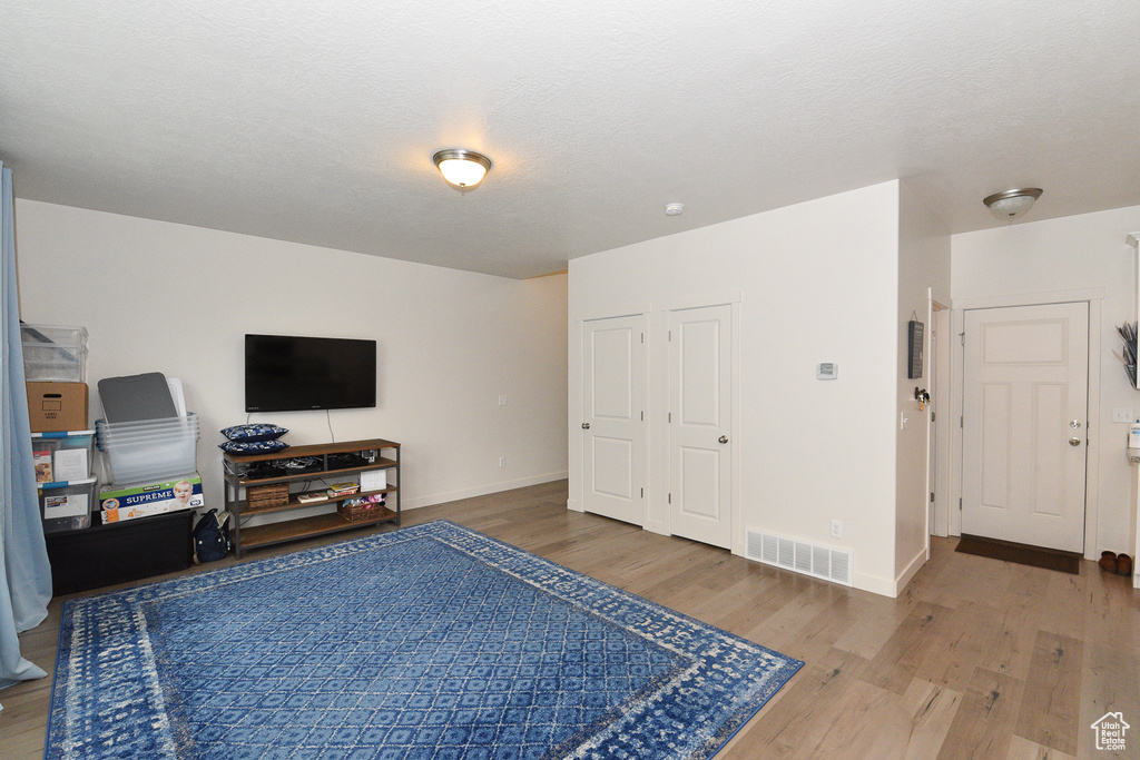 Living room featuring wood finished floors and baseboards