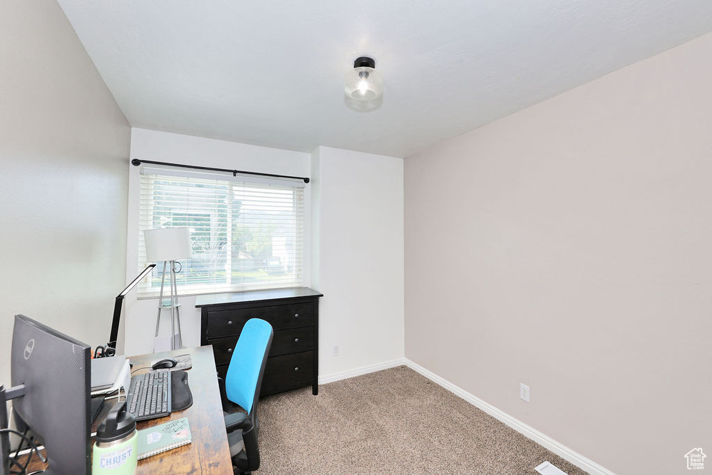 Office with light carpet and baseboards