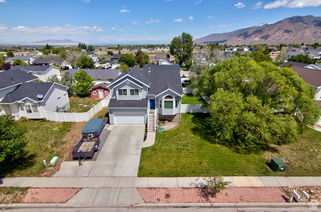 Aerial view of residential area featuring a mountain backdrop