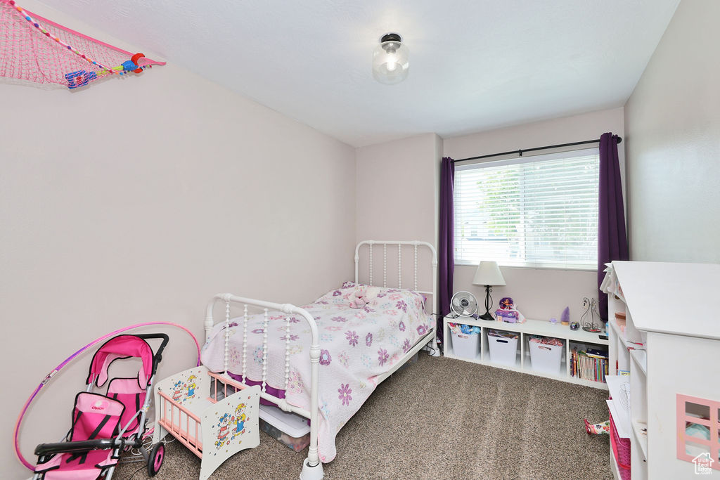 Bedroom featuring carpet