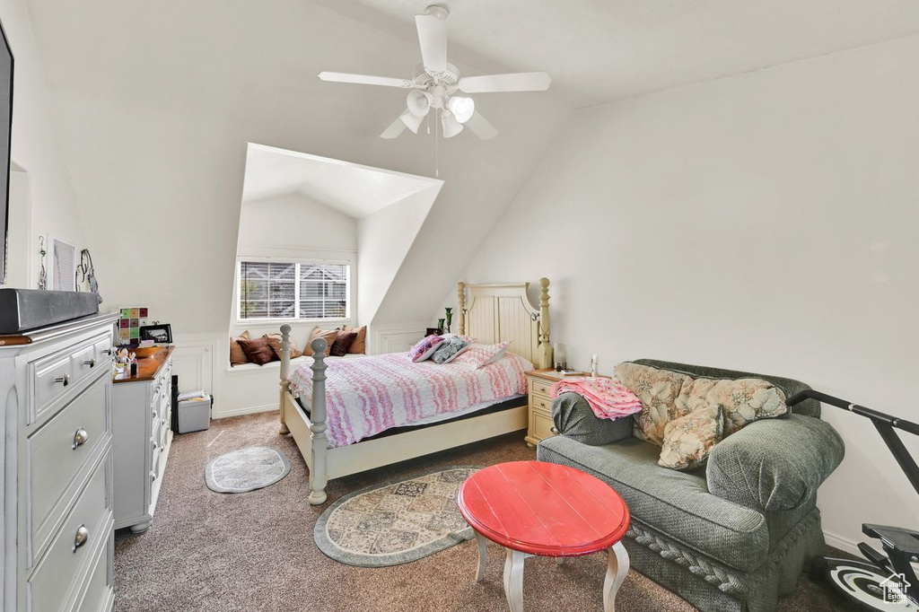 Bedroom featuring carpet, vaulted ceiling, and ceiling fan