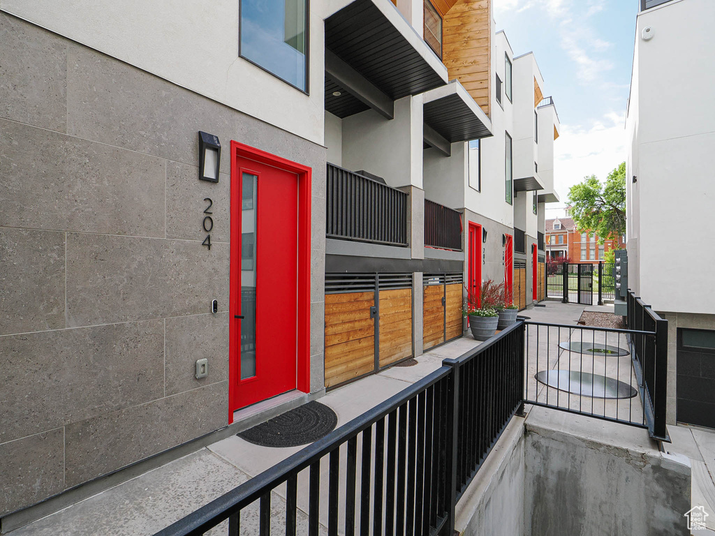 Property entrance featuring stucco siding