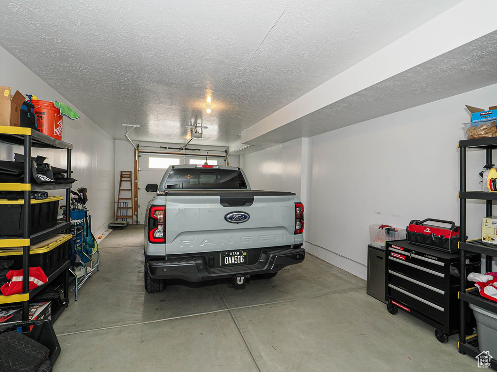 Garage featuring a garage door opener