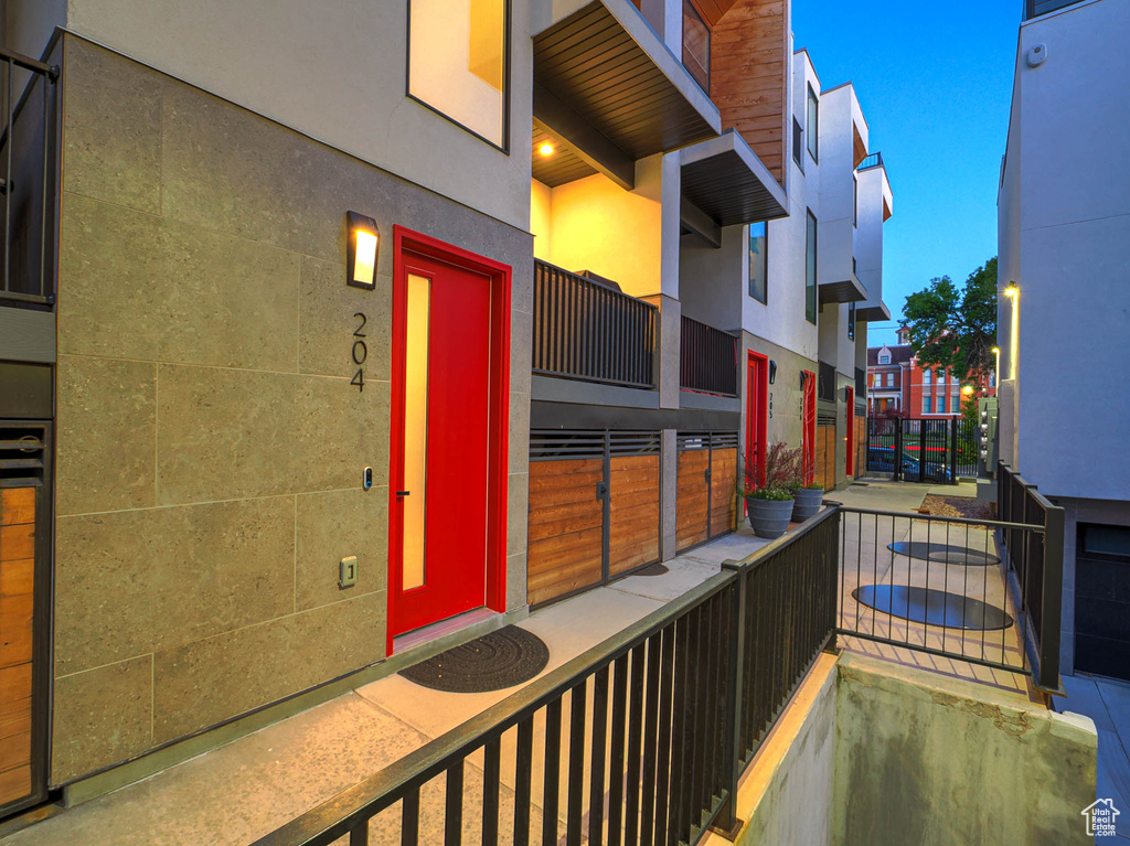 Doorway to property featuring stucco siding