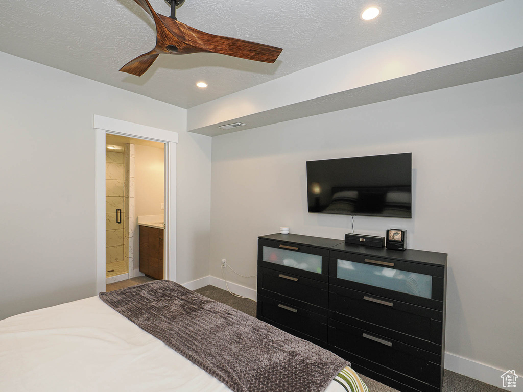 Carpeted bedroom with recessed lighting, baseboards, ensuite bath, and a ceiling fan