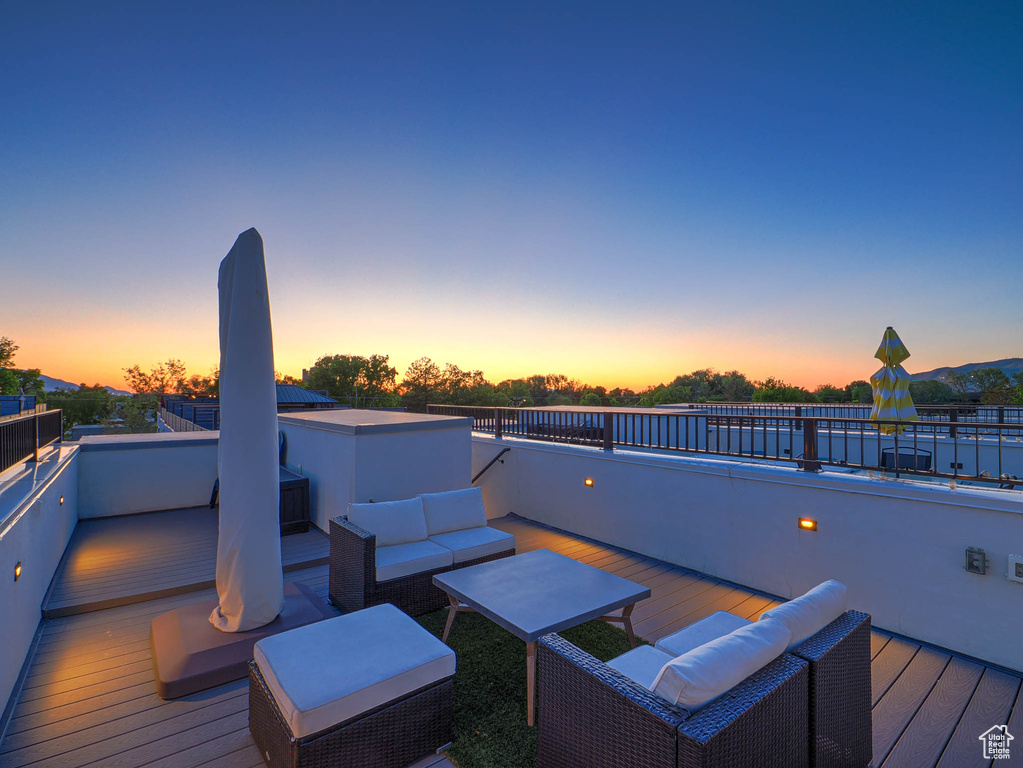 Wooden terrace featuring outdoor lounge area