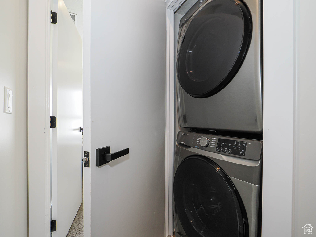 Laundry room featuring stacked washer / dryer