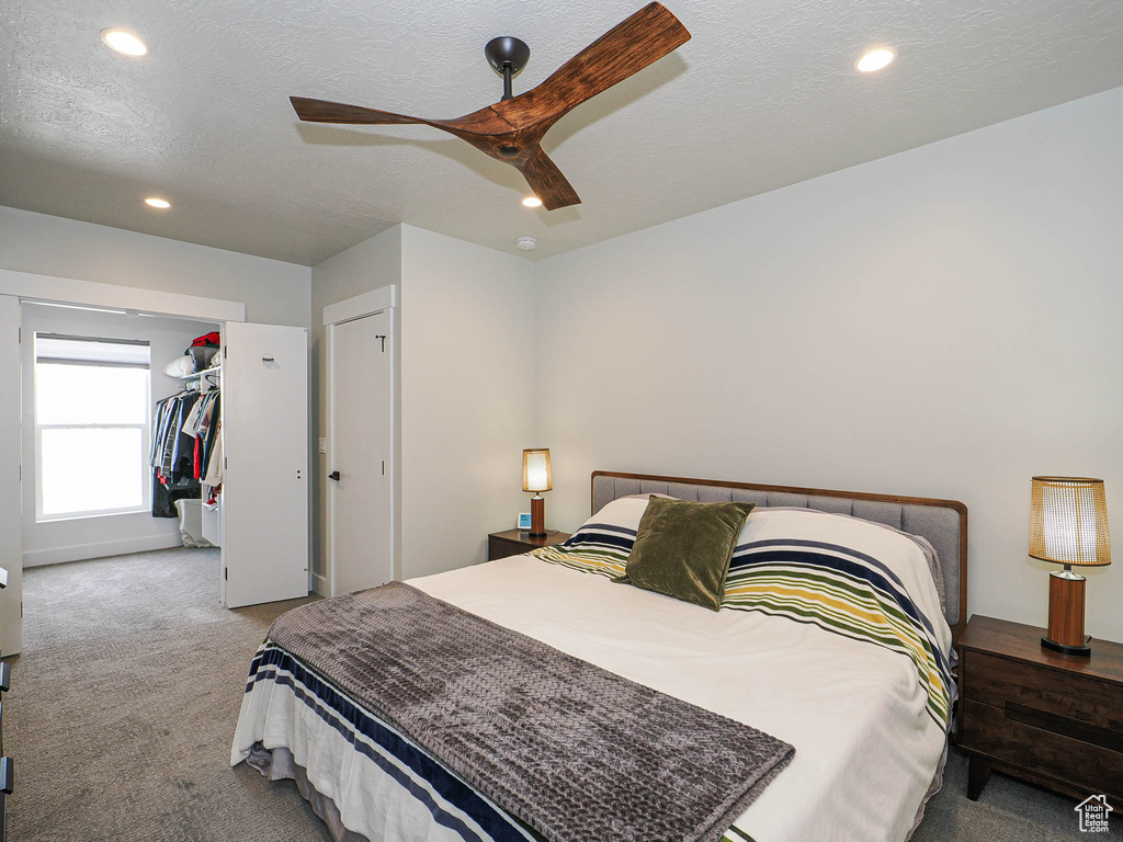 Bedroom featuring carpet floors, recessed lighting, ceiling fan, and a closet