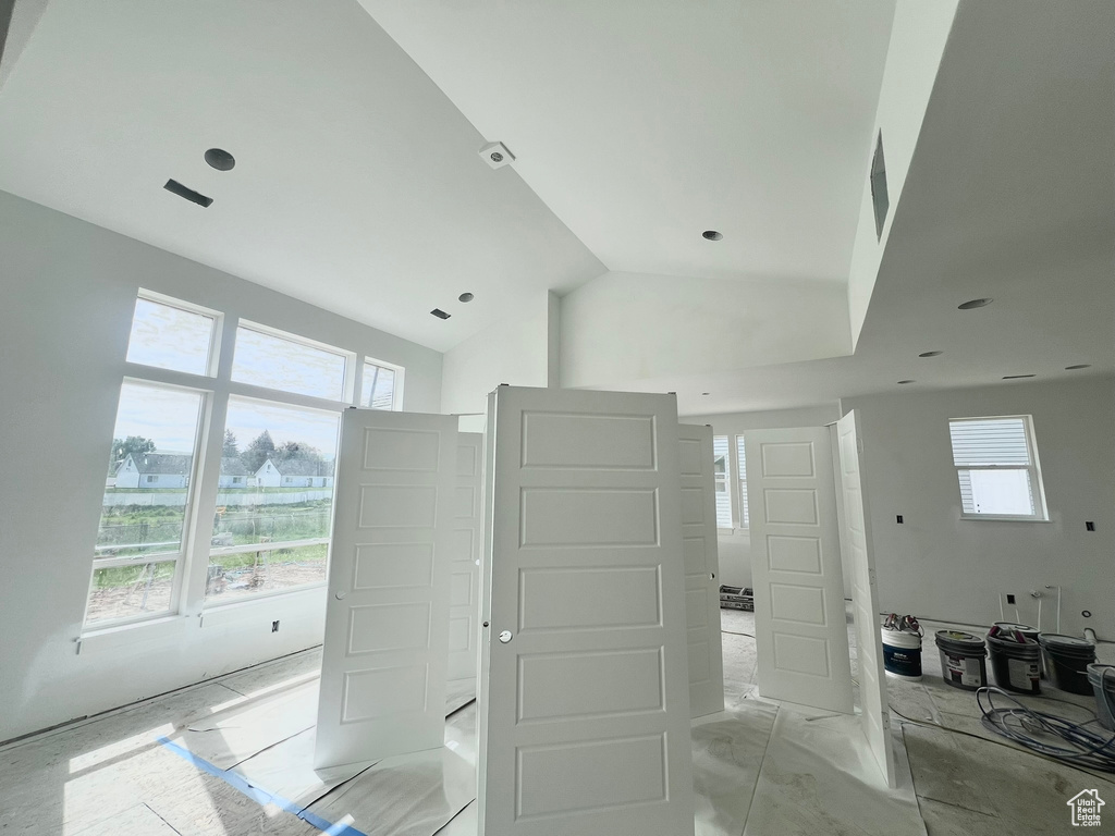 Bathroom featuring plenty of natural light and lofted ceiling