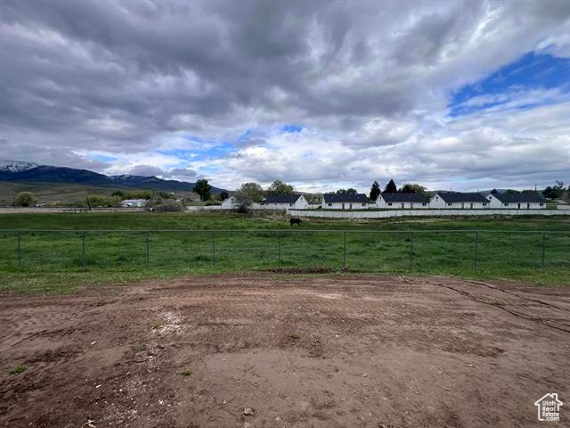 View of yard with a view of rural / pastoral area and a mountain view